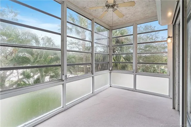 a view of a room with window and wooden floor