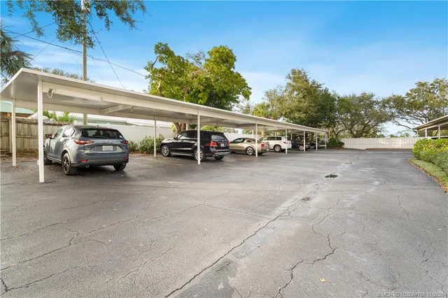 a view of a hallway with wooden shelves