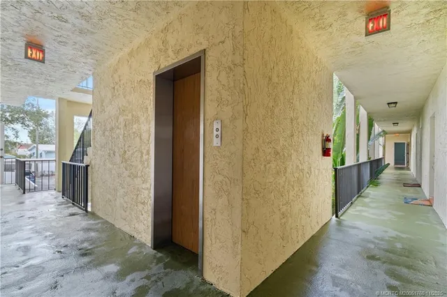 a kitchen with furniture a flat screen tv and a stove