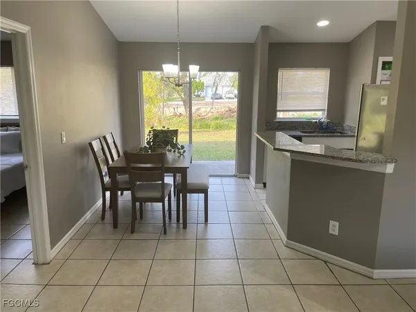 a view of a dining room with furniture window and outside view