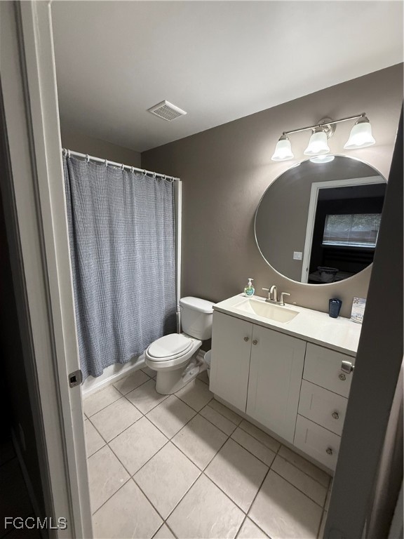 4718 28th Street Southwest Lehigh Acres, FL 33973 - Photo 8 of 12 a bathroom with a sink and mirror