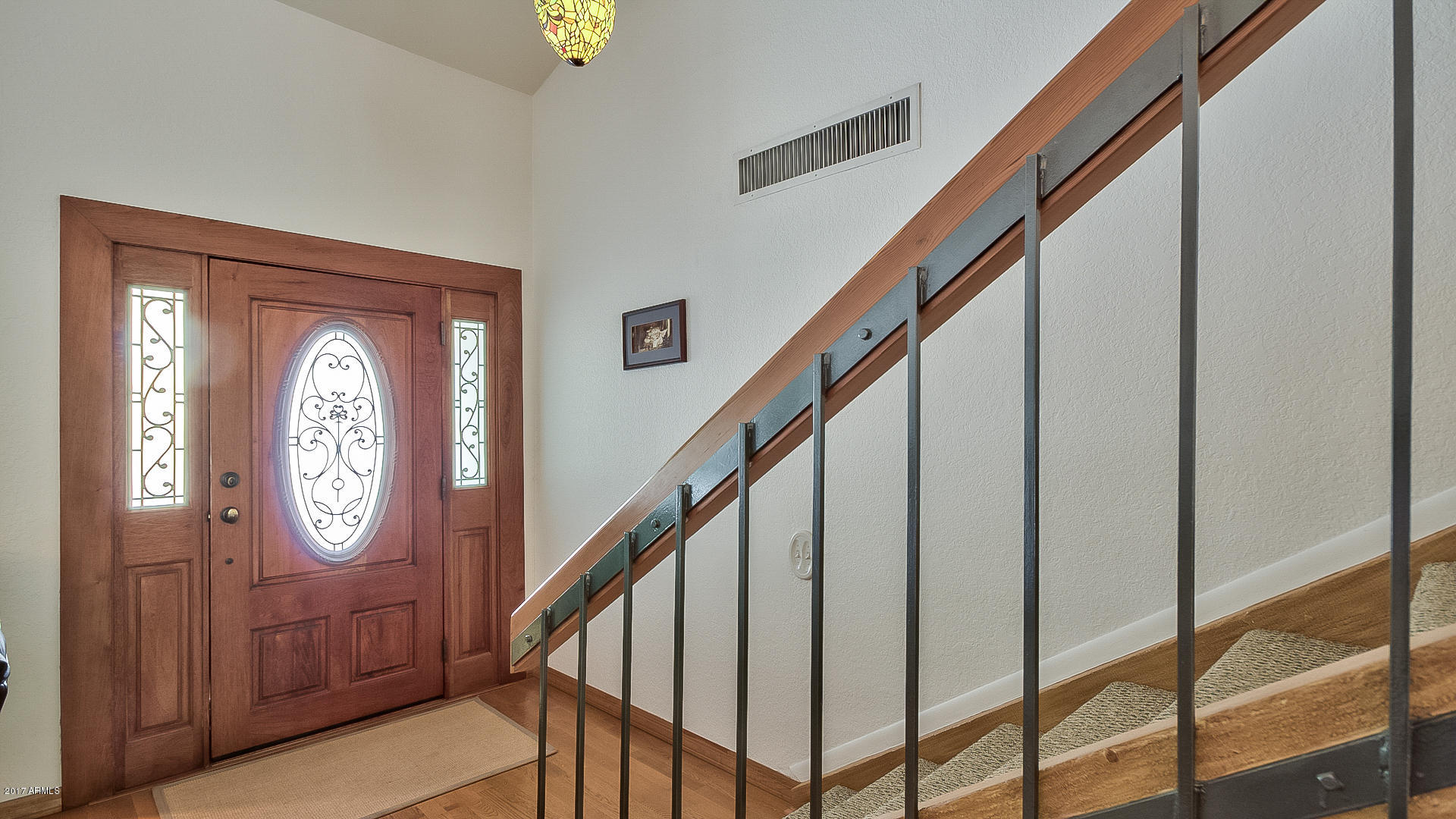 5521 South Rocky Point Road Tempe, AZ 85283 - Photo 4 of 38 a view of entryway with wooden door