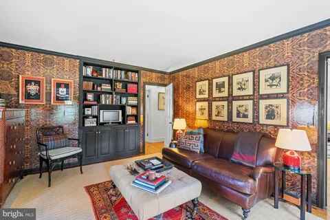 a open kitchen view with stainless steel appliances granite countertop a stove and a wooden floors