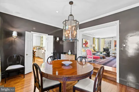 a living room with fireplace furniture and a wooden floor