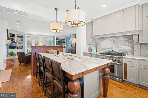 a bathroom with a sink a mirror and a window