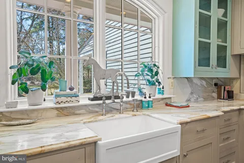 a bedroom with a bed chair and a window