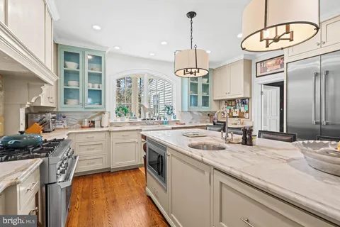a bathroom with a sink a mirror and a window