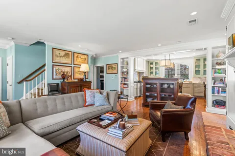a spacious bathroom with a granite countertop sink and a mirror