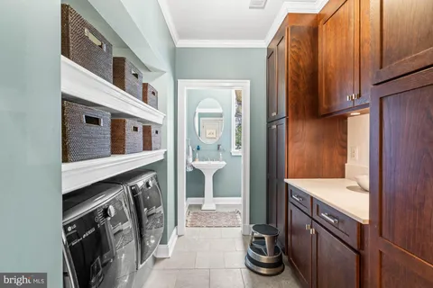 a picture of a room with a white wall and next to a white refrigerator