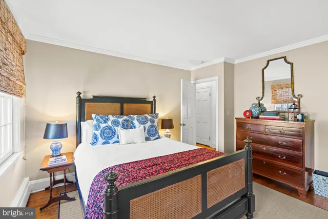 a view of a table and chairs in backyard of the house