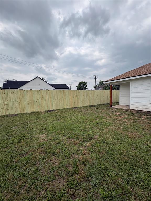 204 North Wiebusch Street Riesel, TX 76682 - Photo 29 of 33 a view of a big yard with an umbrella