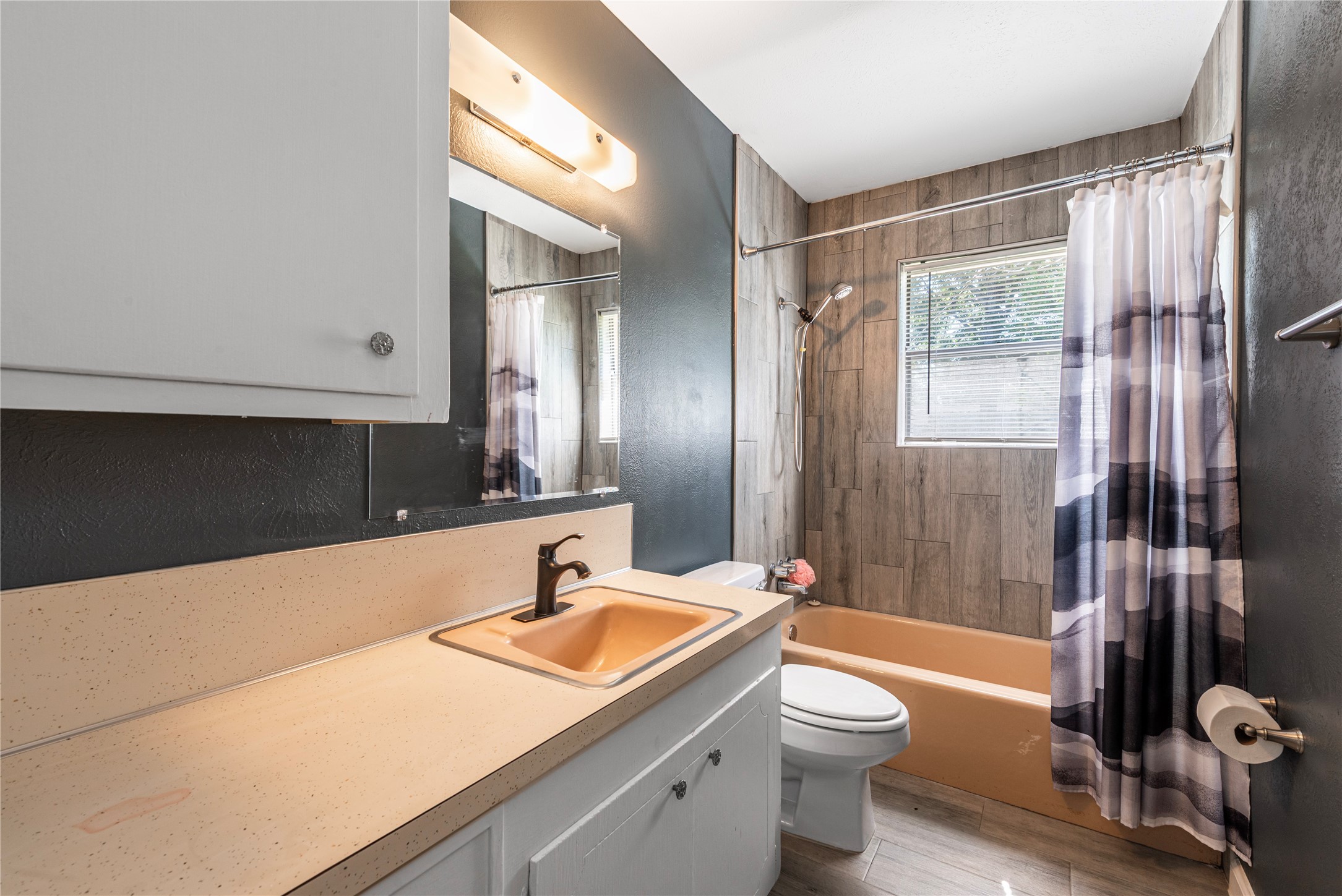 10914 Keese Drive Houston, TX 77089 - Photo 16 of 22 a bathroom with a granite countertop sink toilet a mirror and shower