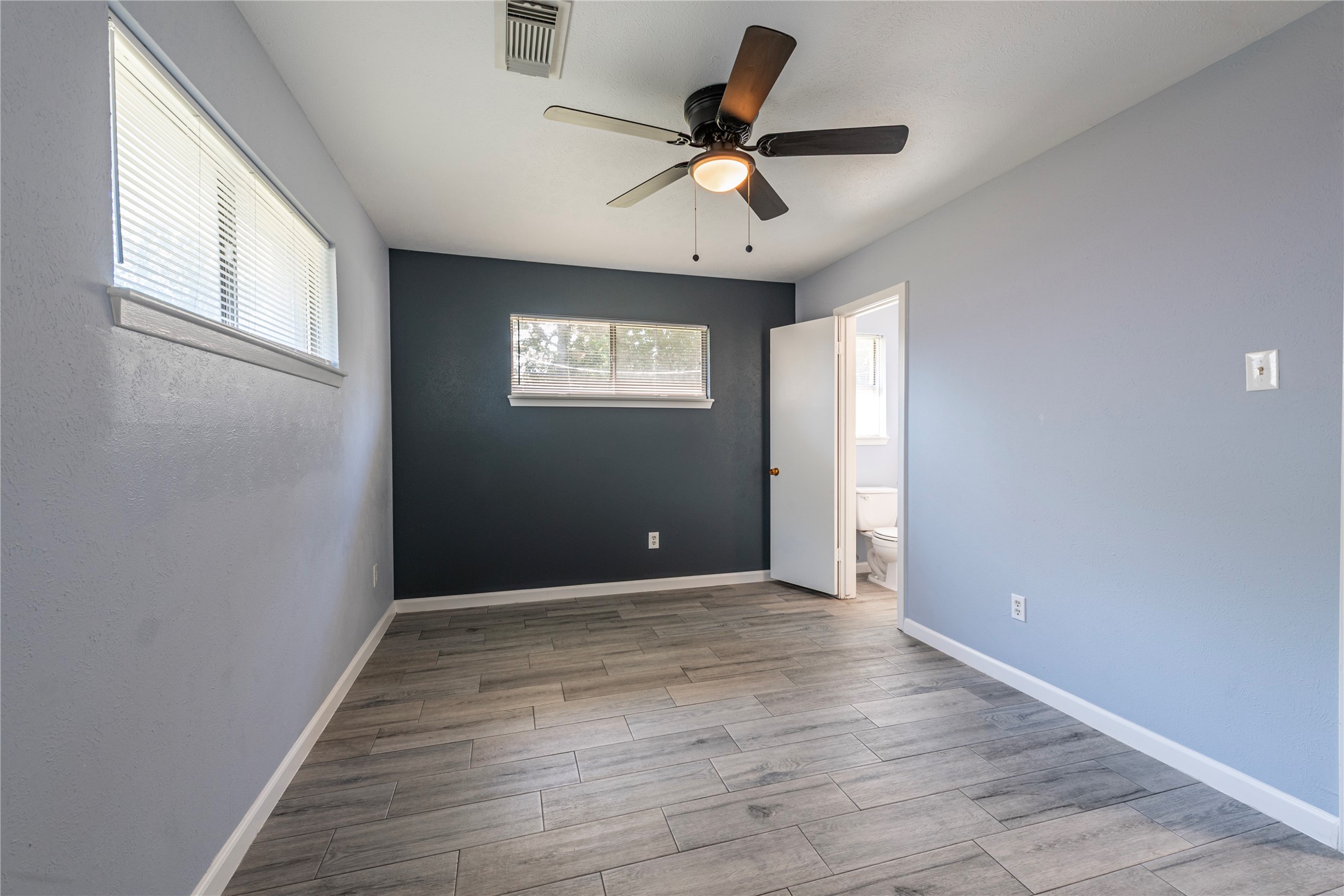 10914 Keese Drive Houston, TX 77089 - Photo 17 of 22 wooden floor in an empty room with a window