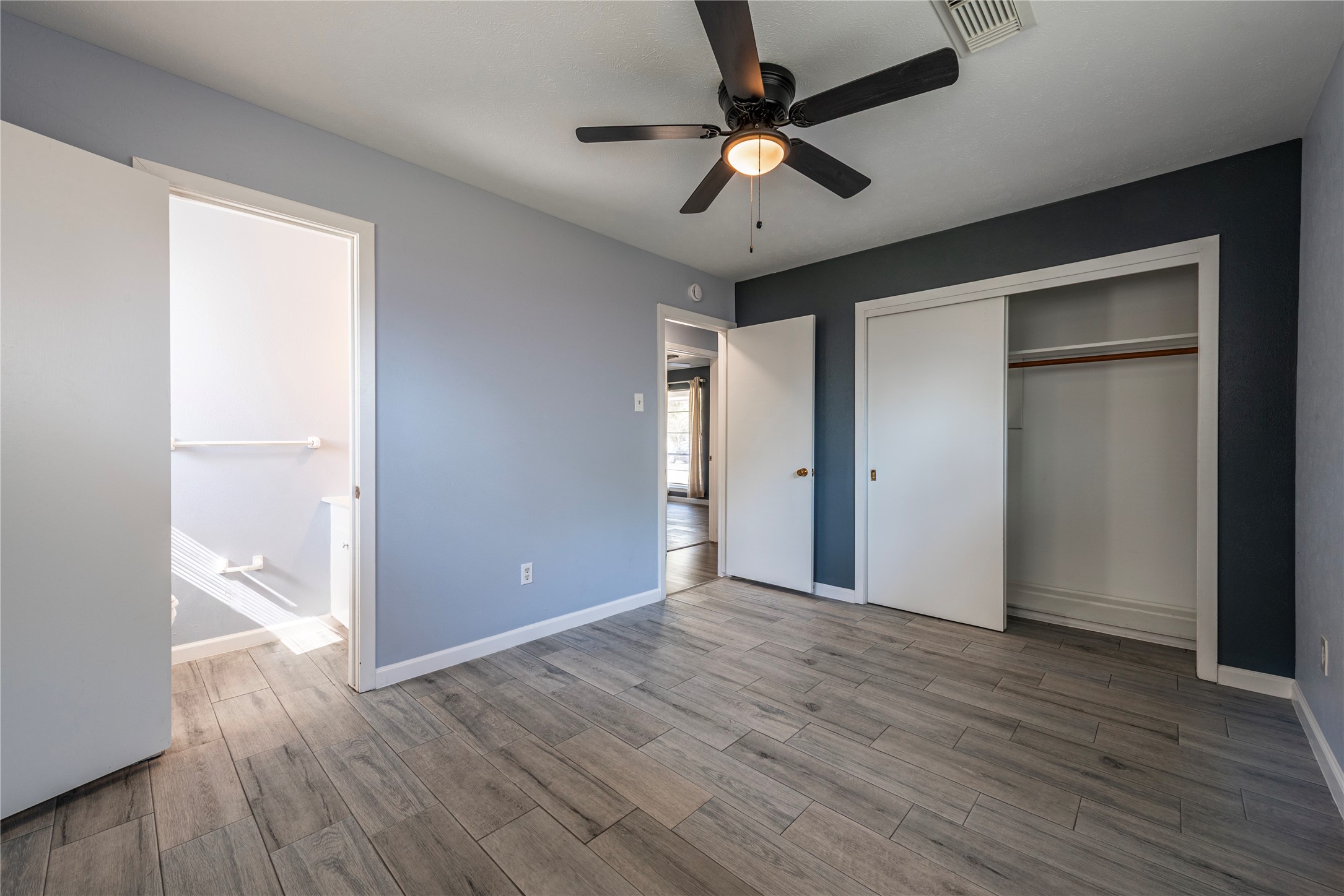 10914 Keese Drive Houston, TX 77089 - Photo 18 of 22 a view of an empty room with wooden floor
