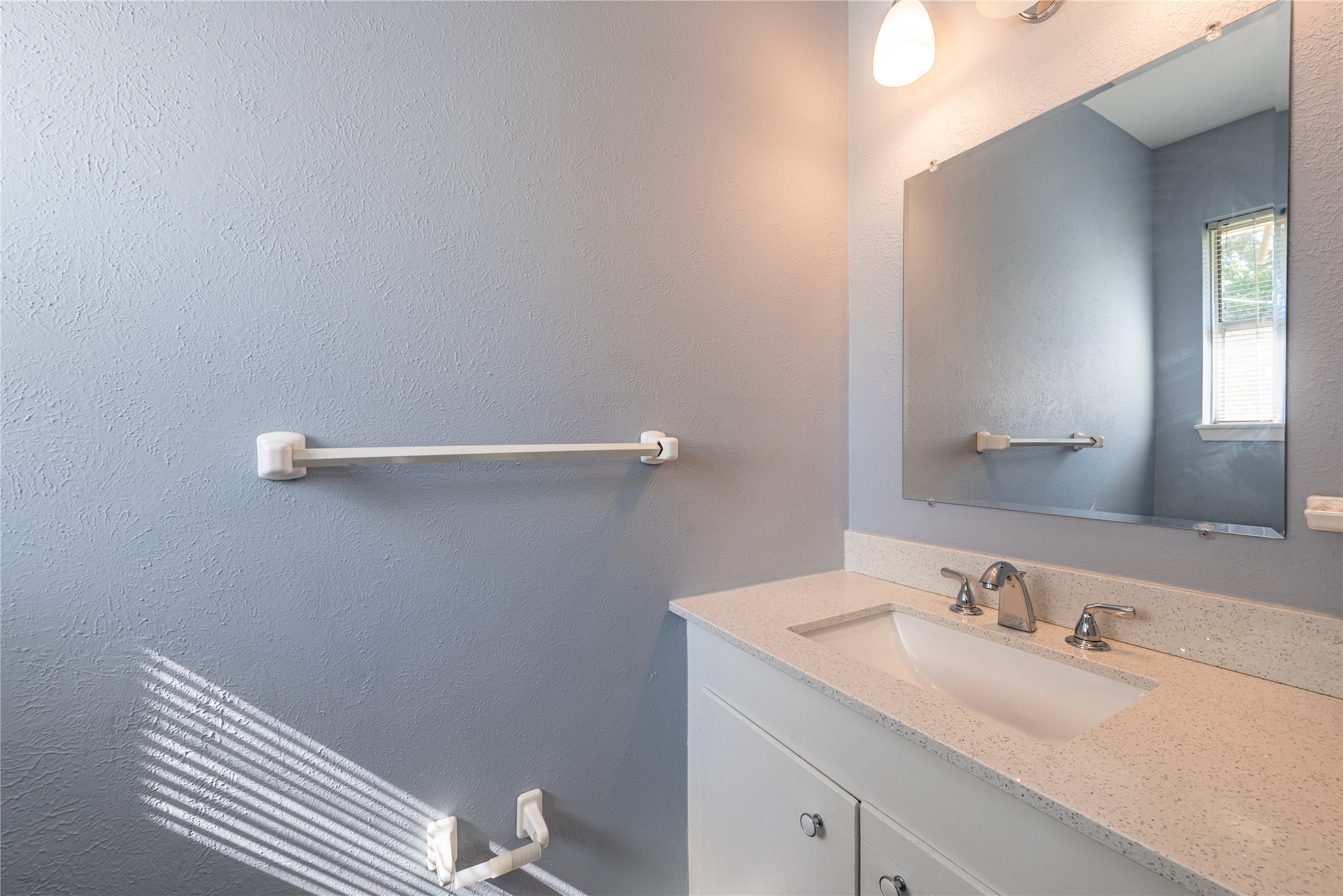 10914 Keese Drive Houston, TX 77089 - Photo 19 of 22 a bathroom with a sink and vanity
