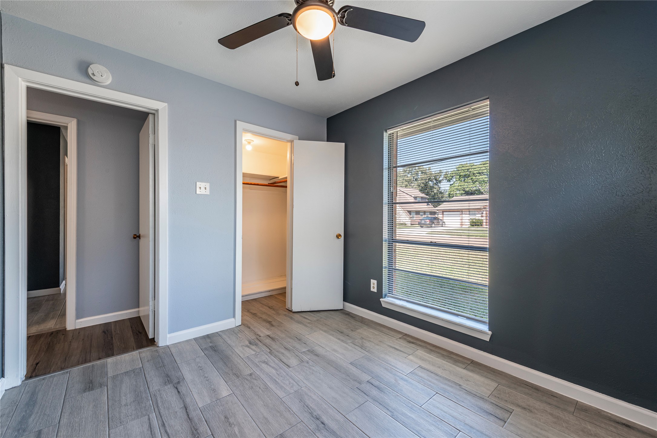 10914 Keese Drive Houston, TX 77089 - Photo 22 of 22 wooden floor in an empty room with a window