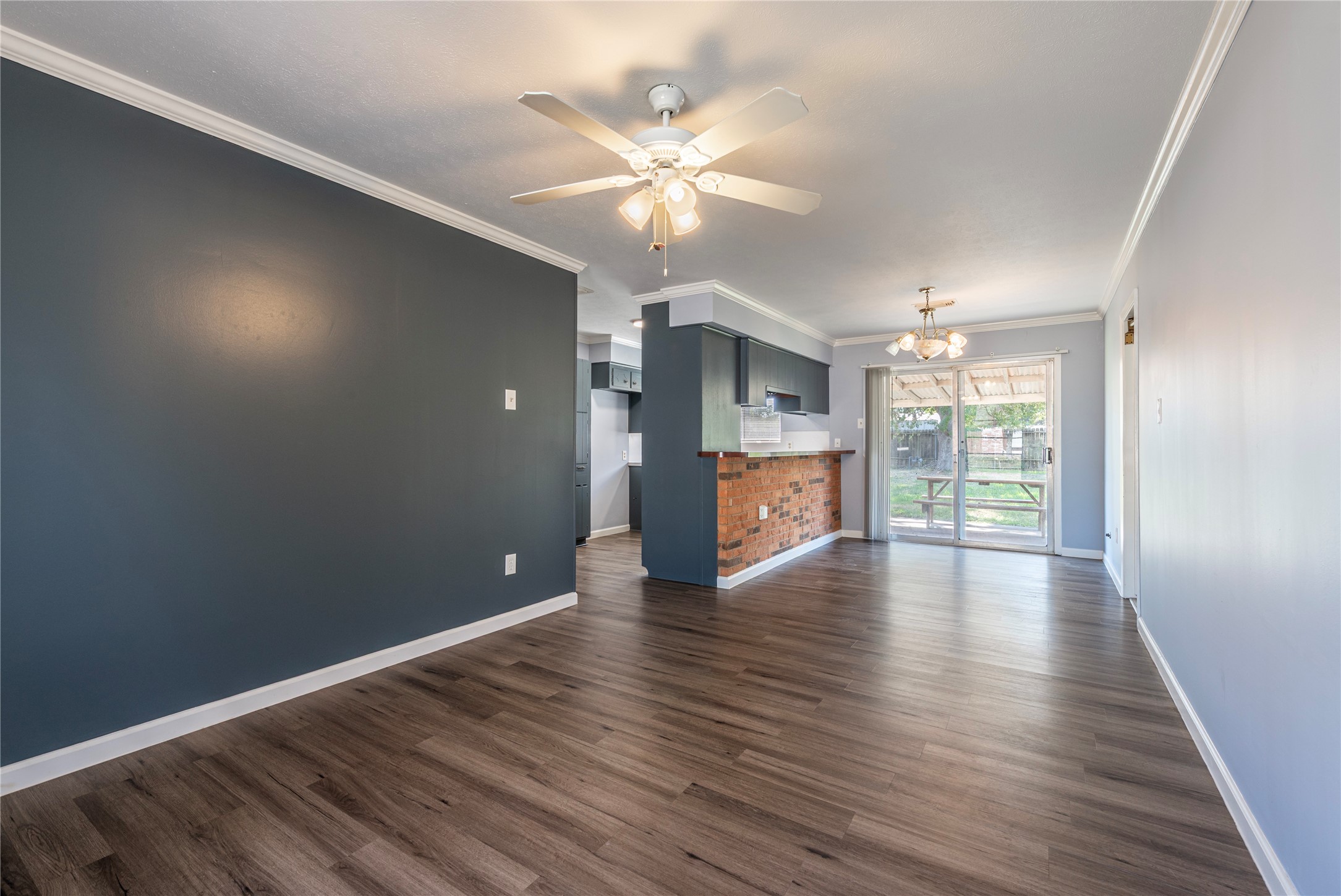 10914 Keese Drive Houston, TX 77089 - Photo 9 of 22 a view of an empty room with wooden floor and a window