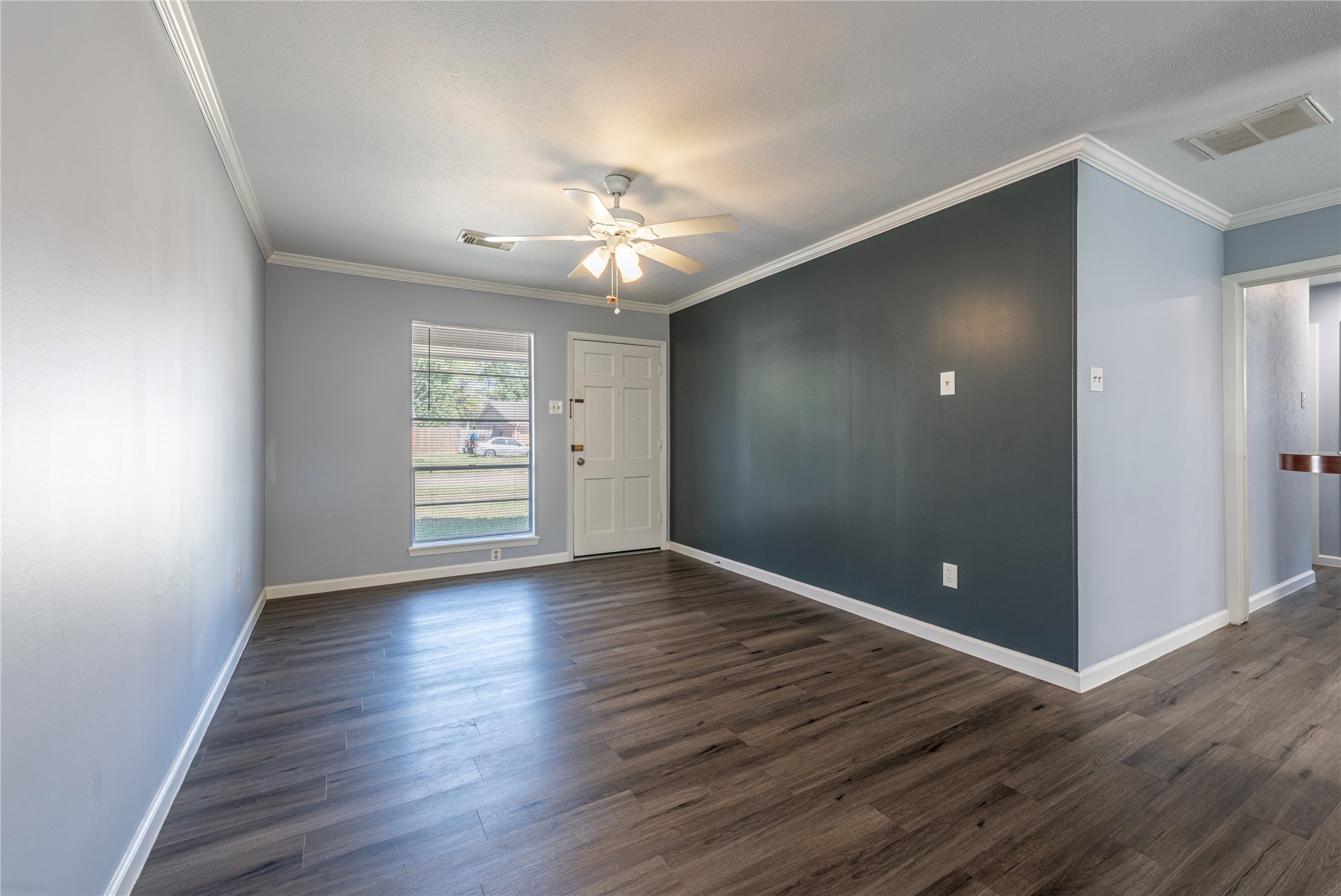 10914 Keese Drive Houston, TX 77089 - Photo 10 of 22 wooden floor in an empty room with a window