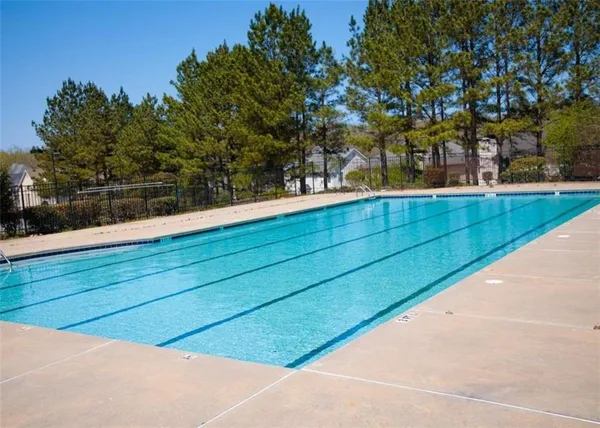 a view of a swimming pool with a patio