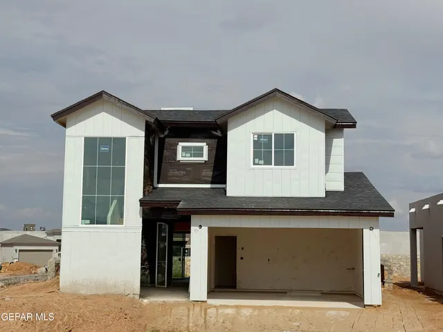 a front view of a house with yard