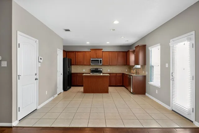 a kitchen with a stove microwave and refrigerator