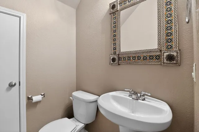 a kitchen with stainless steel appliances granite countertop a sink stove top oven and cabinets