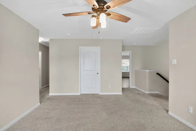 a bathroom with a sink mirror and toilet