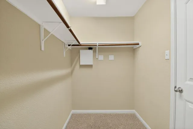 a bathroom with a tub a sink and mirror