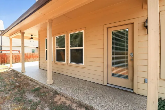 a front view of a house with a yard outdoor seating and garage