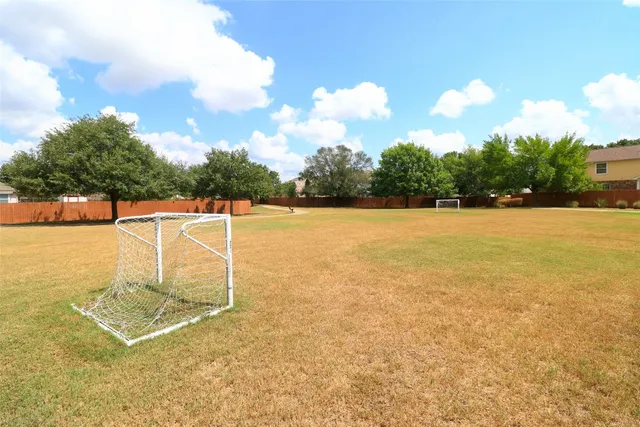 a house view with a backyard space