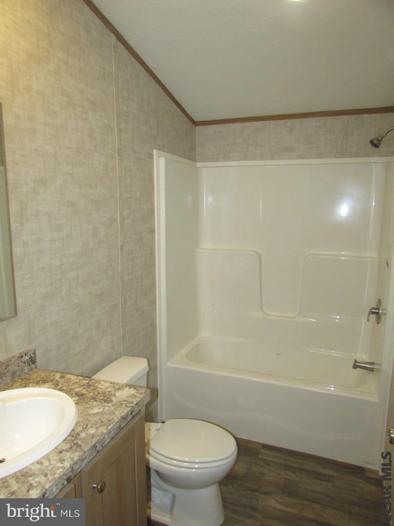 382 Hawk Lane Julian, PA 16844 - Photo 11 of 16 a bathroom with a granite countertop bathtub shower sink vanity and toilet