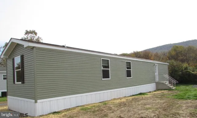 a view of a house with a fence