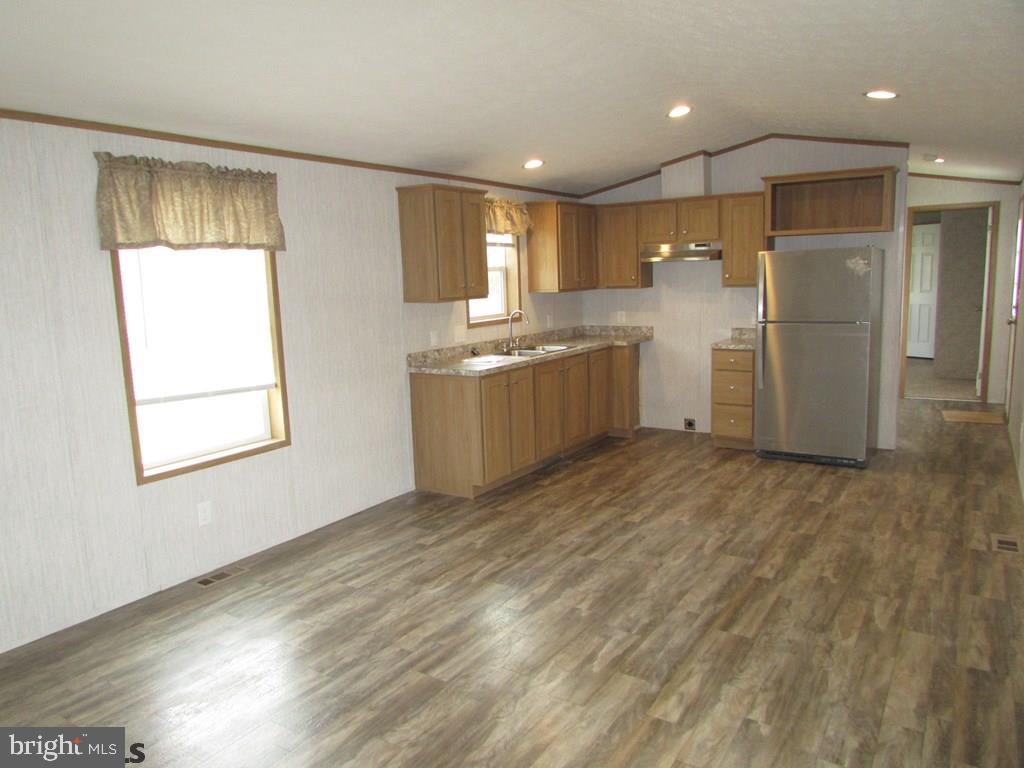 382 Hawk Lane Julian, PA 16844 - Photo 2 of 16 a kitchen with a refrigerator and window