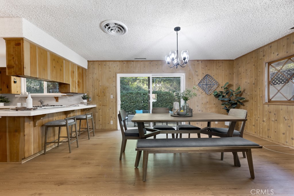 4775 Regalo Road Woodland Hills, CA 91364 - Photo 11 of 42 a view of a dining room with furniture window and outside view