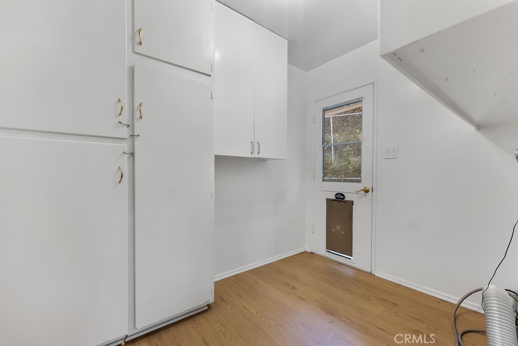 4775 Regalo Road Woodland Hills, CA 91364 - Photo 22 of 42 a view of empty room with wooden floor