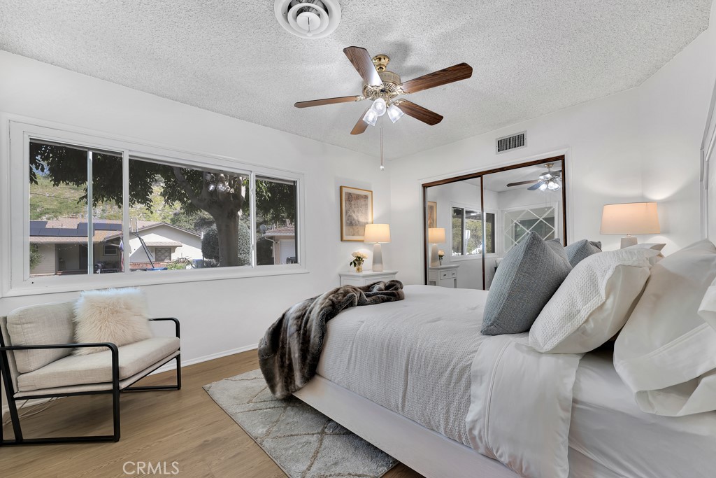 4775 Regalo Road Woodland Hills, CA 91364 - Photo 24 of 42 a bedroom with a large bed and windows