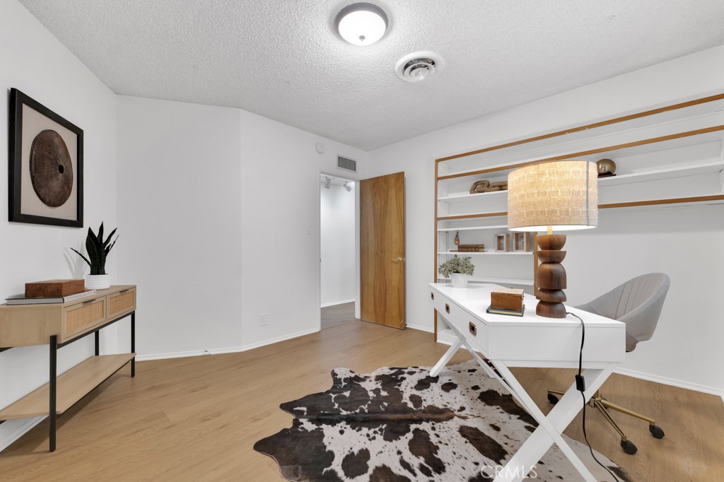 4775 Regalo Road Woodland Hills, CA 91364 - Photo 29 of 42 a view of a workspace with furniture and a window
