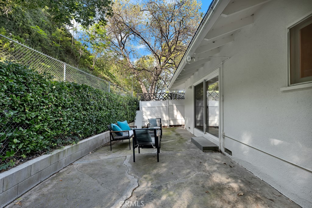 4775 Regalo Road Woodland Hills, CA 91364 - Photo 32 of 42 a building outdoor space with patio furniture