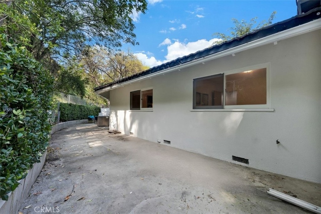 4775 Regalo Road Woodland Hills, CA 91364 - Photo 34 of 42 a view of a house with backyard