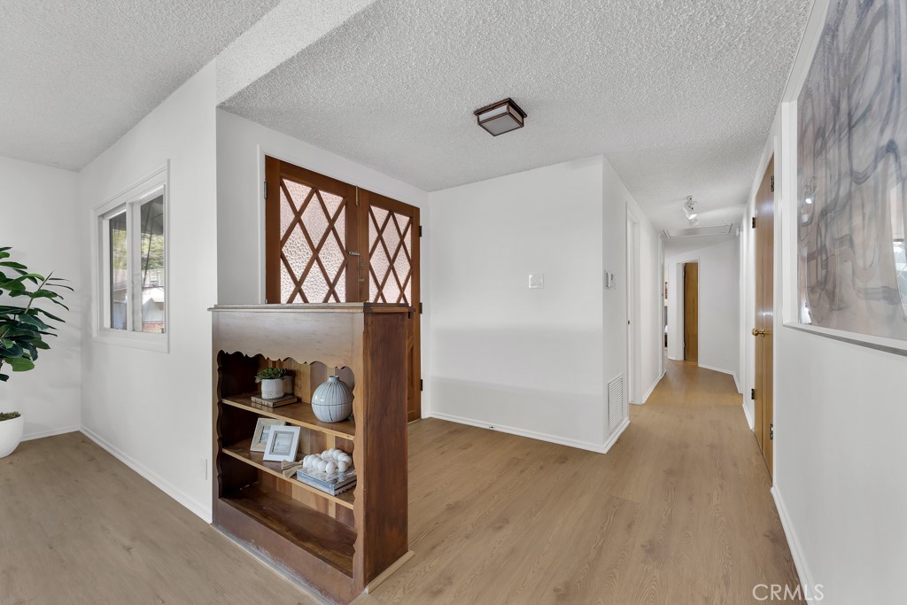 4775 Regalo Road Woodland Hills, CA 91364 - Photo 4 of 42 a view of an entryway with wooden floor
