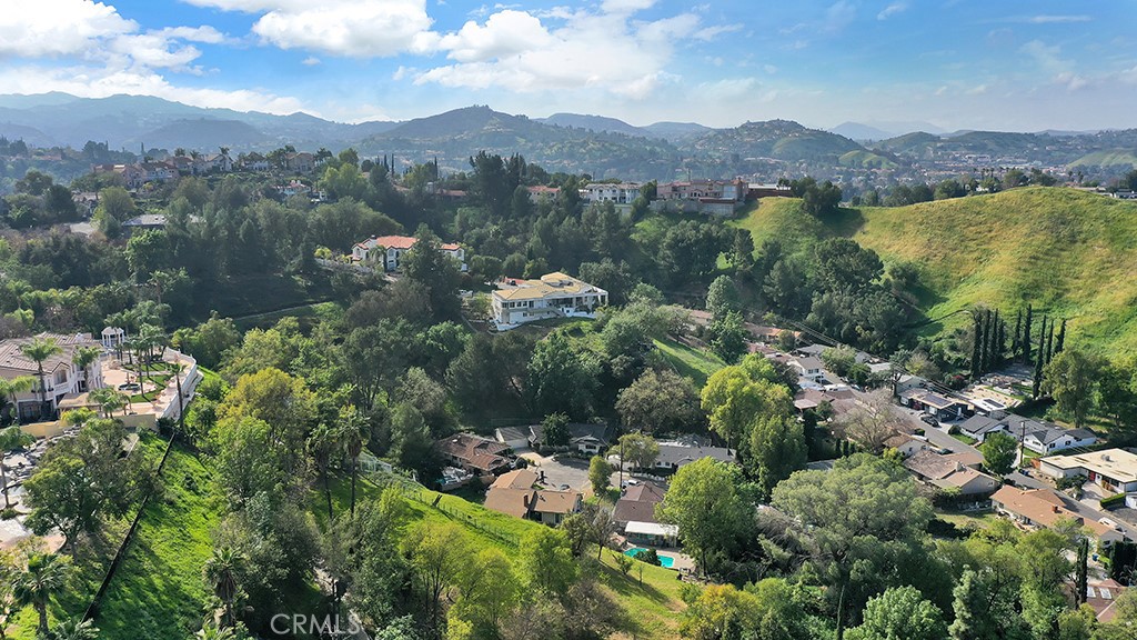 4775 Regalo Road Woodland Hills, CA 91364 - Photo 42 of 42 a view of a city with mountain