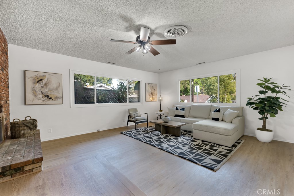 4775 Regalo Road Woodland Hills, CA 91364 - Photo 5 of 42 a living room with furniture rug and window