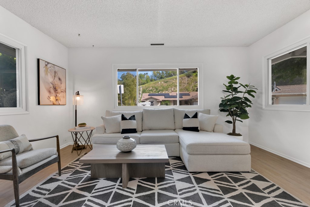 4775 Regalo Road Woodland Hills, CA 91364 - Photo 6 of 42 a living room with furniture a window and a potted plant