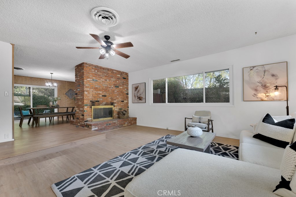 4775 Regalo Road Woodland Hills, CA 91364 - Photo 7 of 42 a bedroom with furniture and a large window