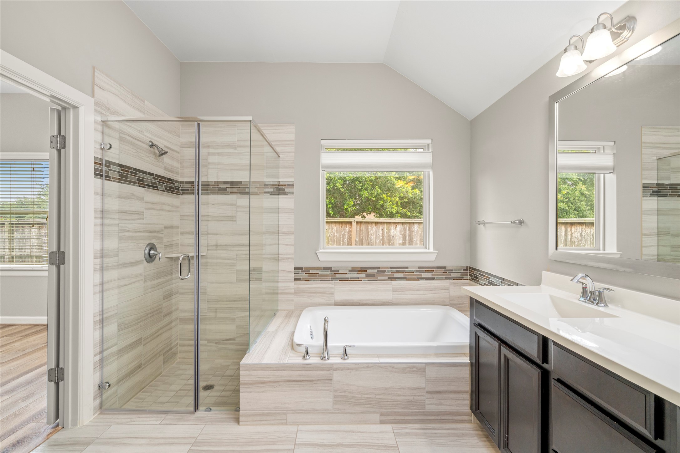 143 Castlegate Lane Houston, TX 77065 - Photo 13 of 33 Primary bath, with frameless shower (curbless), separate tub. Dual vanity (not fully shown here)