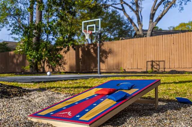 a wooden bench sitting in front of a pool