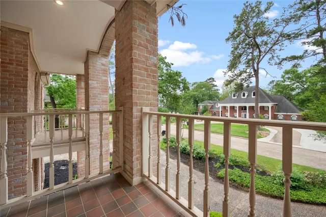 a view of a balcony with chairs