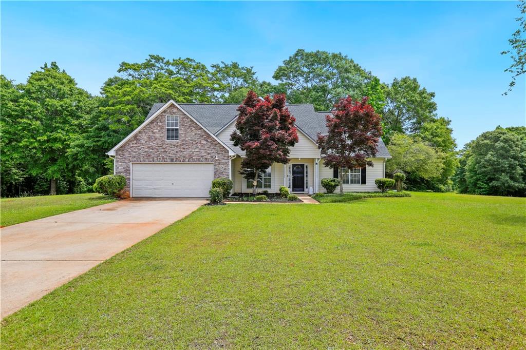 1300 Sunflower Court Locust Grove, GA 30248 - Photo 1 of 24 a front view of house with yard and green space