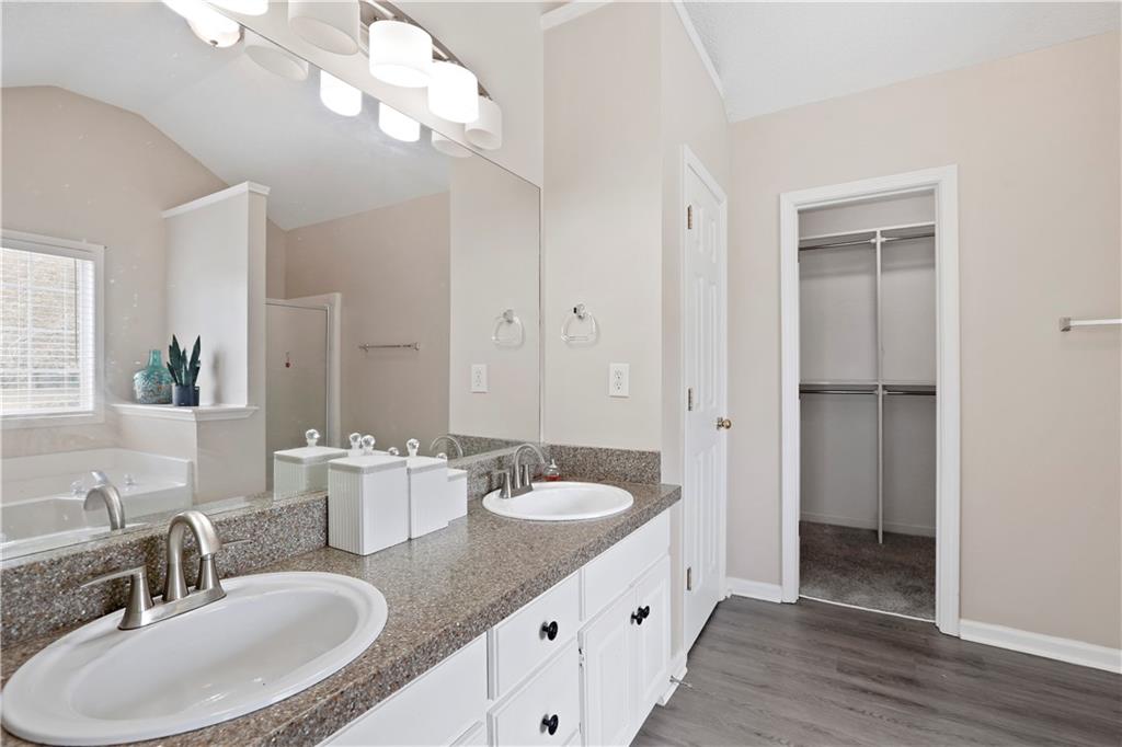 1300 Sunflower Court Locust Grove, GA 30248 - Photo 19 of 24 a bathroom with a sink double vanity and a mirror