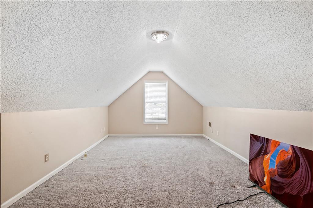 1300 Sunflower Court Locust Grove, GA 30248 - Photo 20 of 24 an empty room with windows